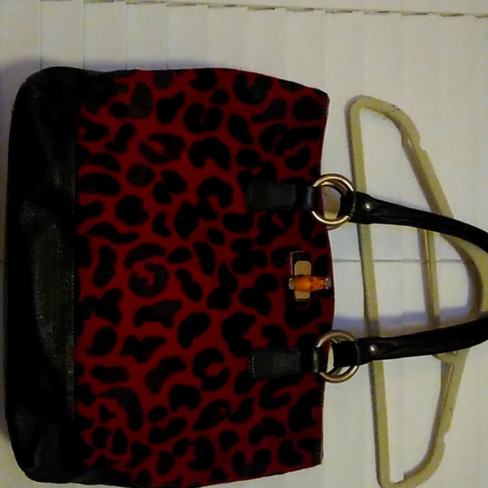 Red and black leopard print hide bag made by Claudia Firenze.